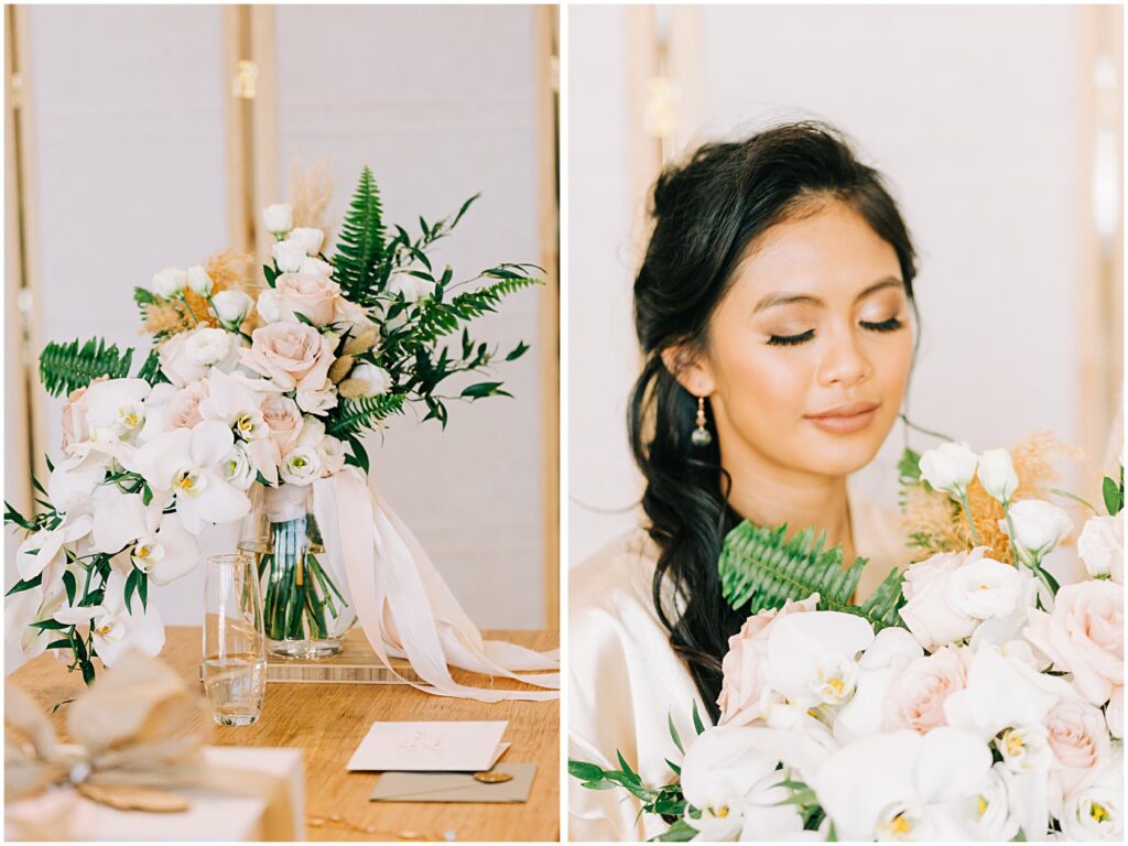 blush pink roses with white orchids in a vase on a table with a gift, cards, envelope, glass of water, model holding creative bridal bouquet