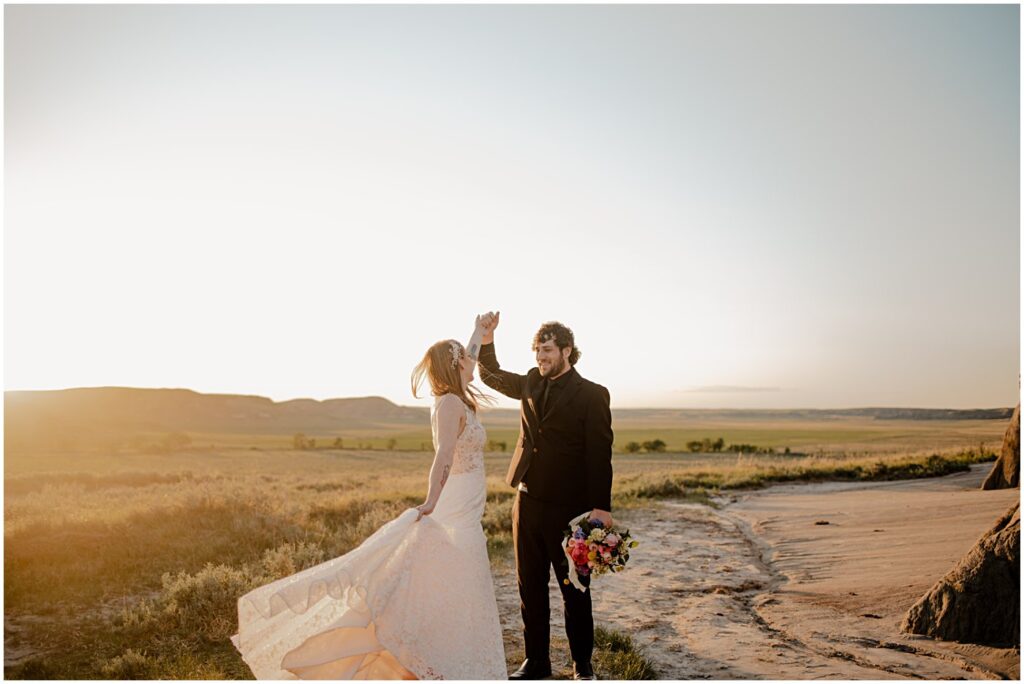 wedding couple dancing at golden hour