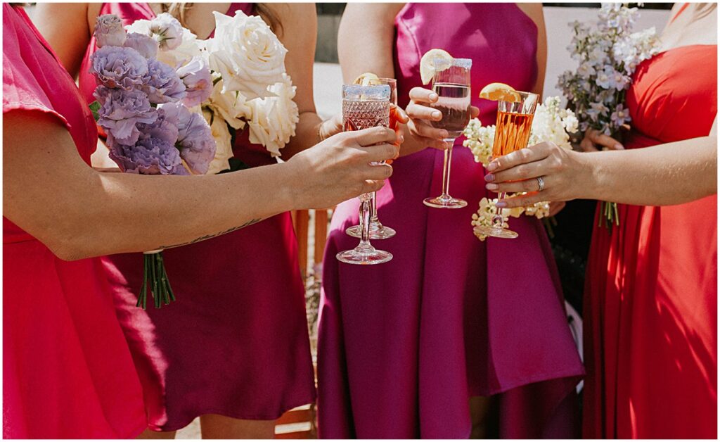 wedding party having drinks, clinking glasses