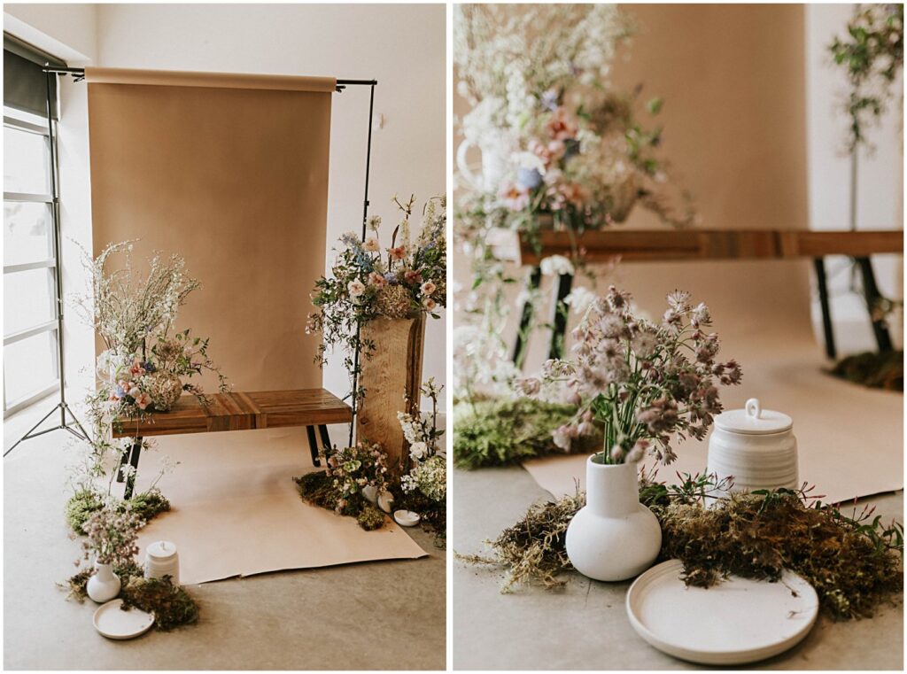 muted florals on a bench with a neutral backdrop, soft blush tones with earthy green moss