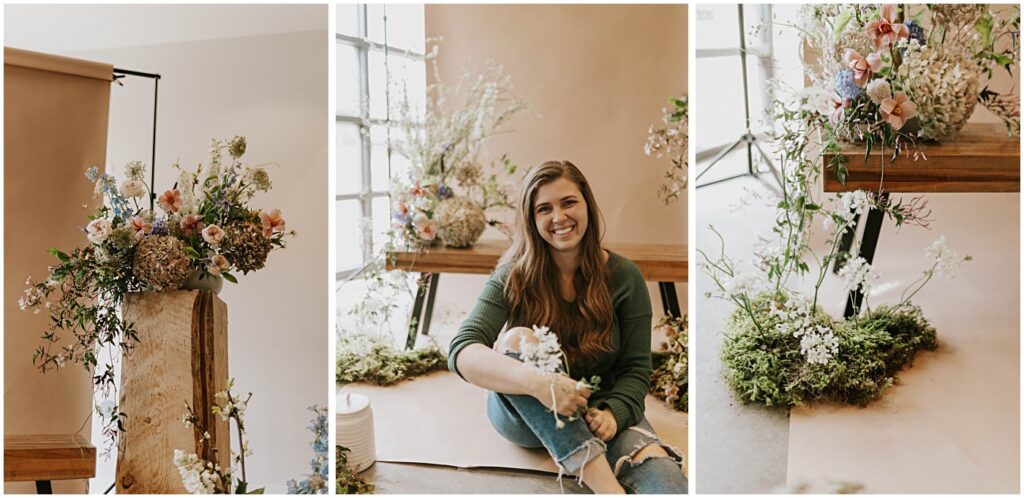 muted florals on a bench with a neutral backdrop, soft blush tones with earthy greens, wedding florist holding flowers