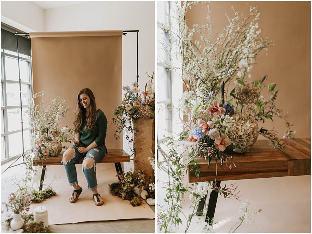 muted florals on a bench with a neutral backdrop, soft blush tones with earthy greens, wedding florist sitting on bench