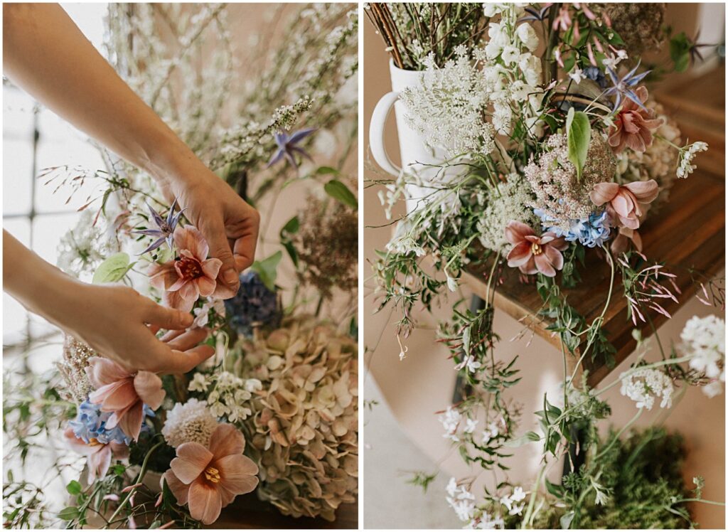 muted florals on a bench with a neutral backdrop, soft blush tones with earthy greens, wedding florist arranging flowers