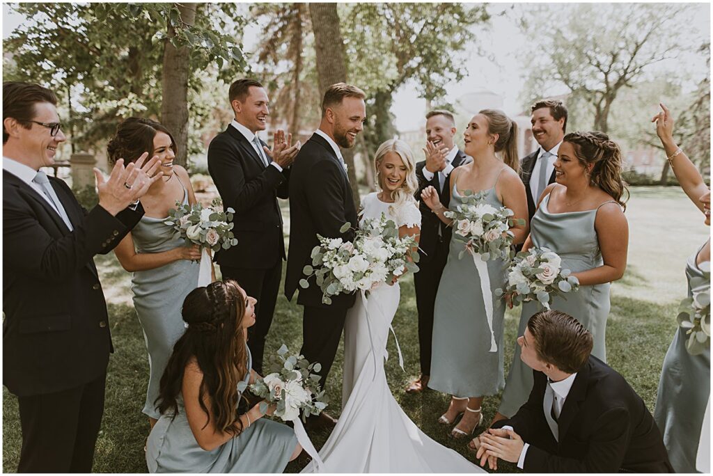 wedding party holding wedding flowers