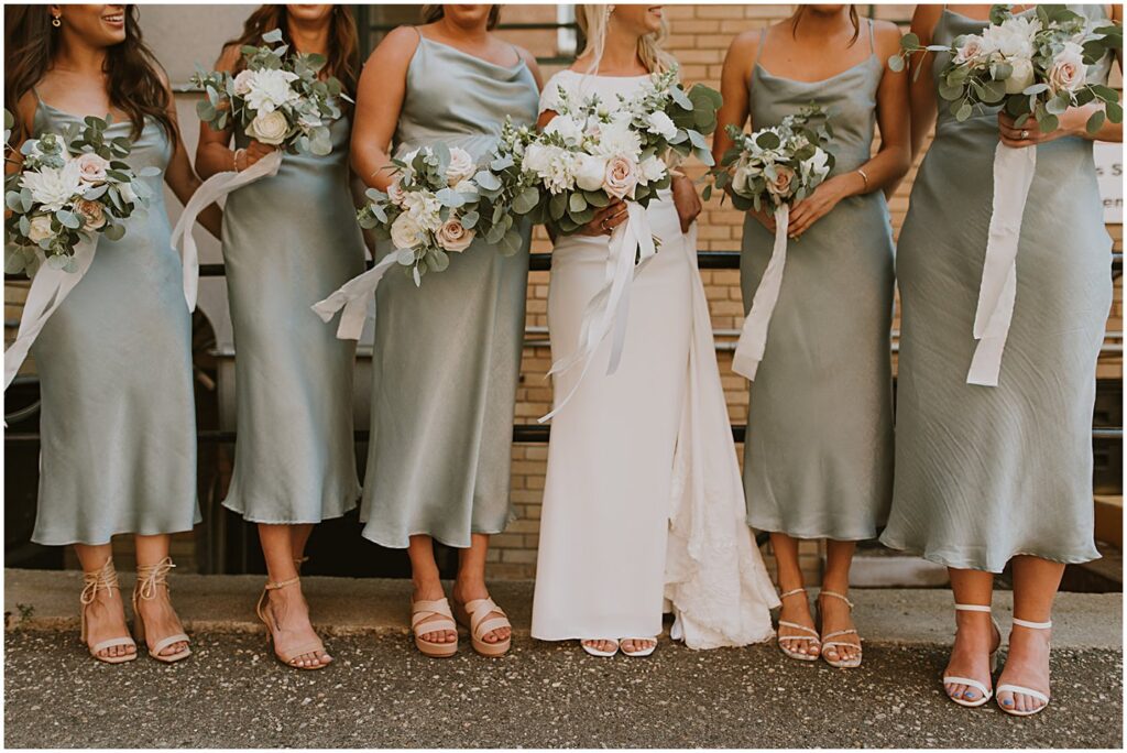 bridesmaids holding wedding flower bouquets