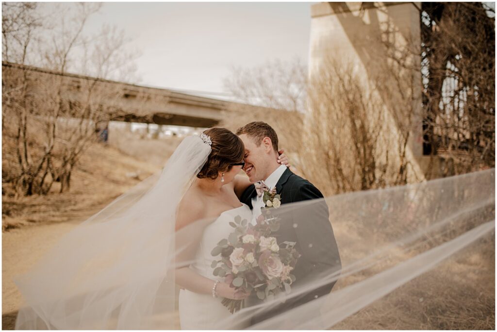 blush and burgundy florals with a wedding couple portrait for elegant spring wedding