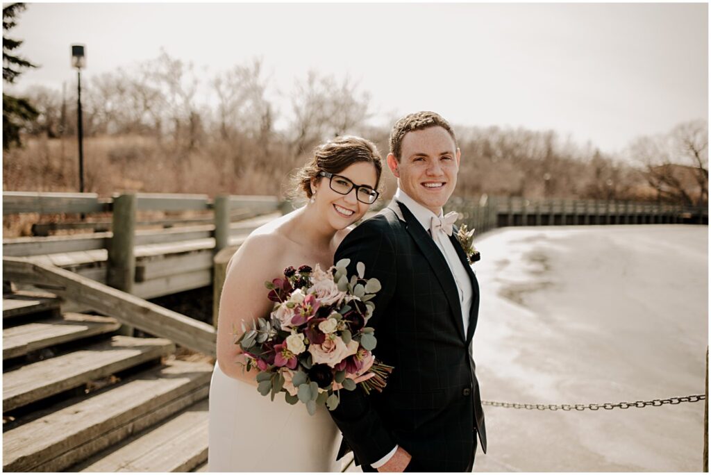 blush and burgundy florals with a wedding couple portrait