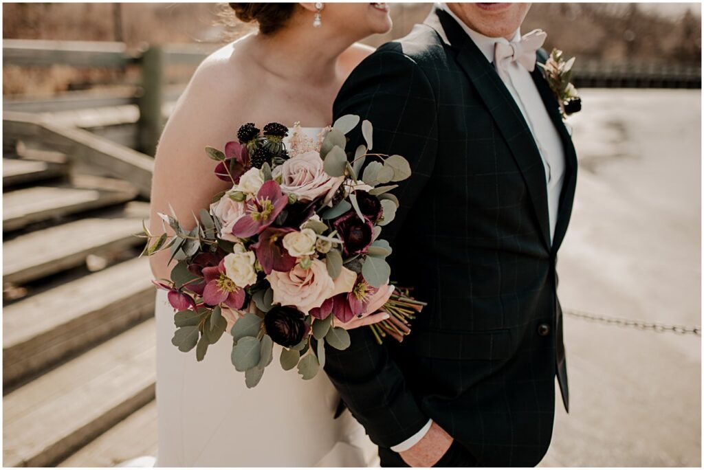 blush and burgundy florals with a wedding couple portrait for elegant spring wedding